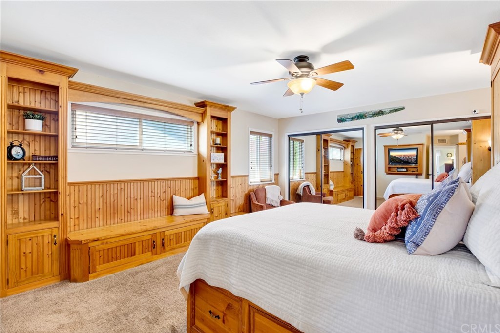 844 Eastman Place San Pedro, CA 90731 - Photo 20 of 44 a bedroom with a large bed and a chandelier