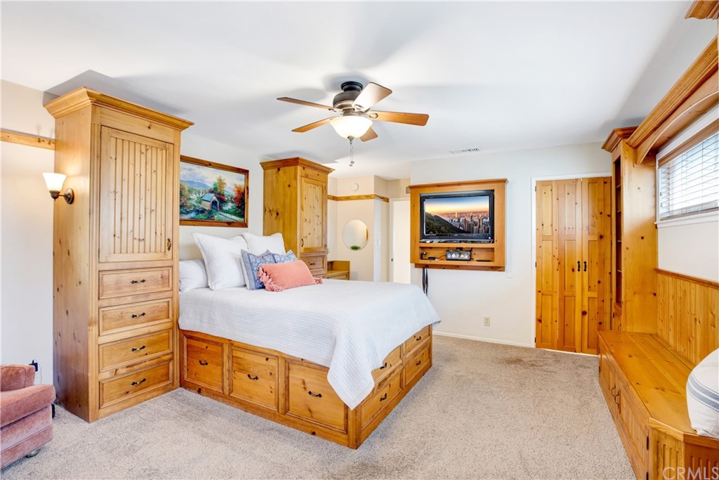 844 Eastman Place San Pedro, CA 90731 - Photo 21 of 44 a bedroom with a bed and a chandelier