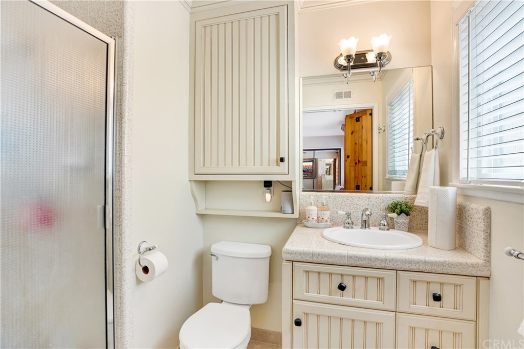 844 Eastman Place San Pedro, CA 90731 - Photo 23 of 44 a bathroom with a sink toilet and mirror