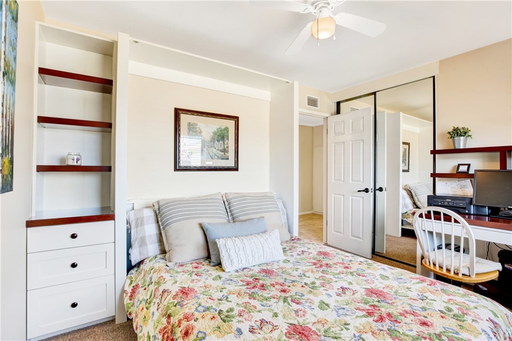 844 Eastman Place San Pedro, CA 90731 - Photo 28 of 44 a bedroom with a bed and a chandelier