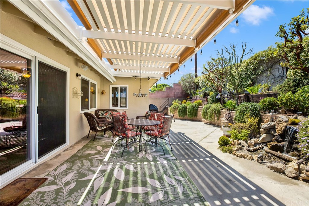844 Eastman Place San Pedro, CA 90731 - Photo 32 of 44 a view of a patio with table and chairs and potted plants