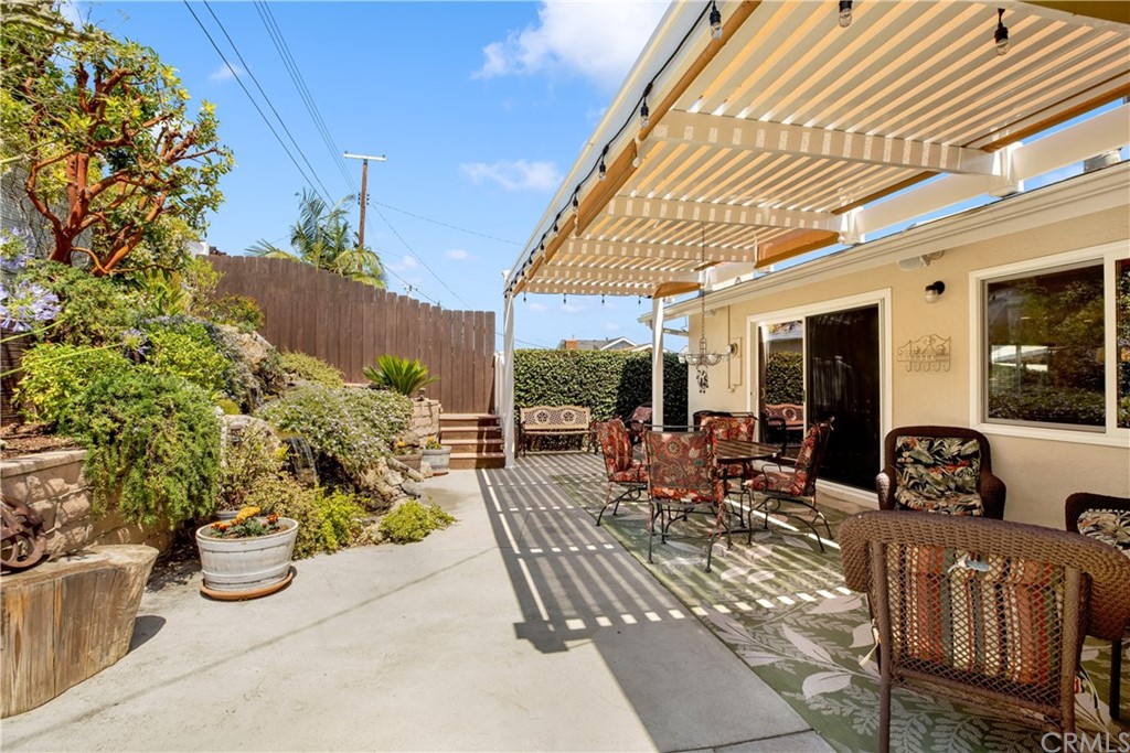 844 Eastman Place San Pedro, CA 90731 - Photo 33 of 44 a view of a patio with dining table and chairs potted plants