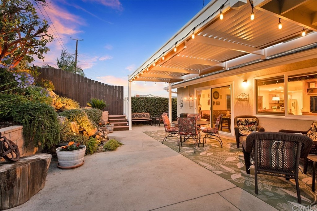 844 Eastman Place San Pedro, CA 90731 - Photo 39 of 44 a view of a patio with table and chairs potted plants and a large tree