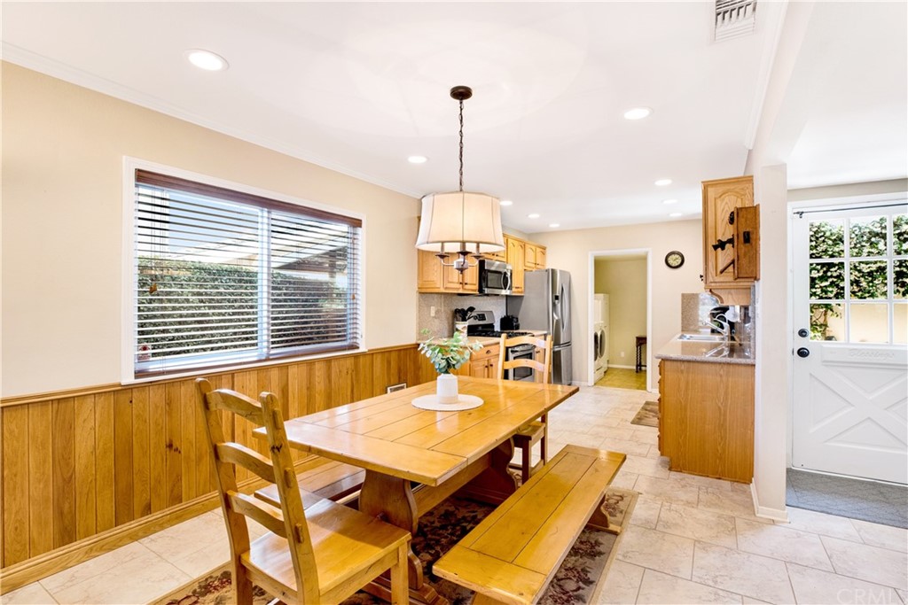 844 Eastman Place San Pedro, CA 90731 - Photo 5 of 44 a living room with furniture a chandelier and a dining table