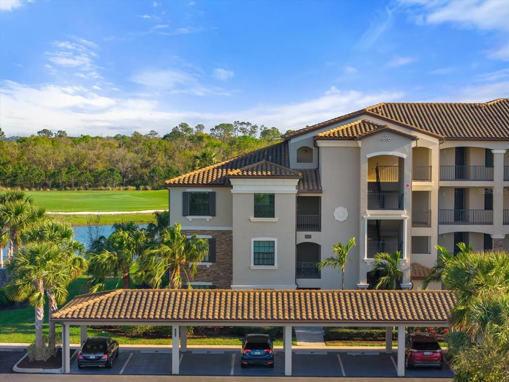 16904 Vardon Terrace, Unit 301 Lakewood Ranch, FL 34211 - Photo 2 of 53 a view of a house with a roof deck