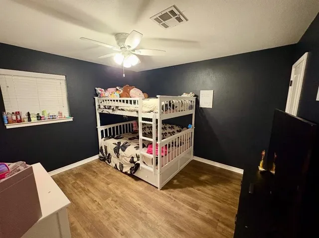 a bed room with a bed and a chandelier