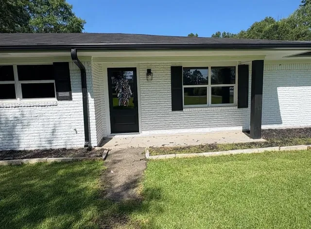 a front view of a house with a yard