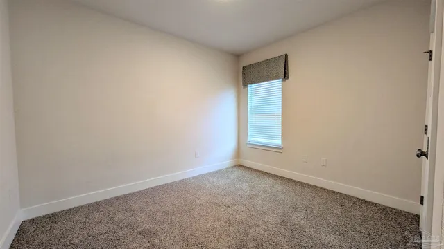 an empty room with a empty space and window