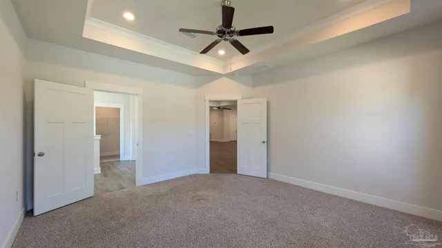 an empty room with a ceiling fan and a ceiling fan