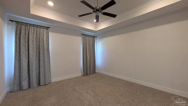 a spacious bathroom with a double vanity sink and mirror