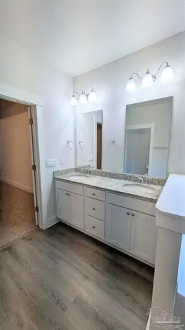 a view of a bathroom with a sink and a mirror