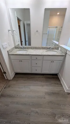 a bathroom with a bathtub and a sink