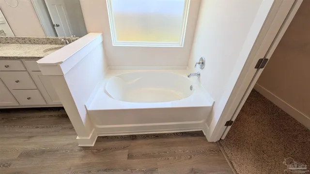 a bathroom with a glass shower door