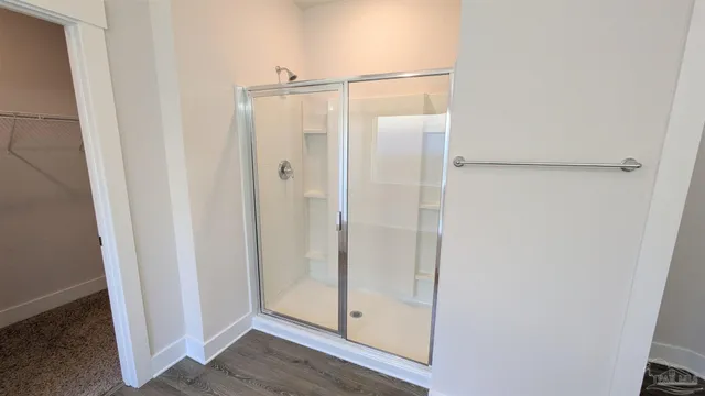 a view of an empty room with windows