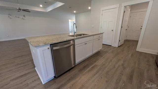 a kitchen with a sink and cabinets