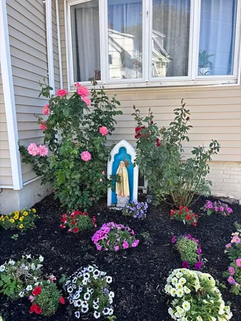 a flower vase with flowers and flowers