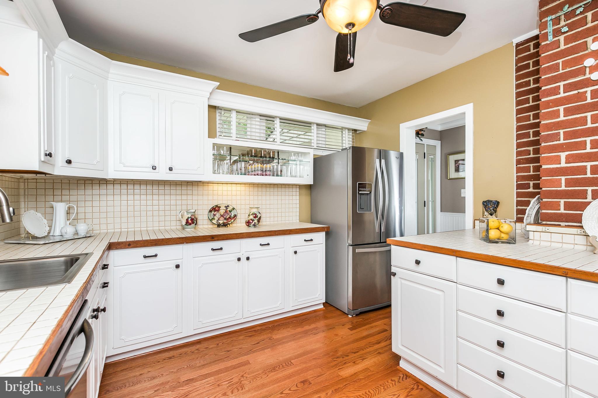 2103 Oak Lodge Road Catonsville, MD 21228 - Photo 13 of 39 Ceiling fan, hardwood floors, pretty cabinets