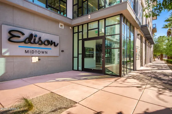 a large kitchen with stainless steel appliances granite countertop a sink stove and refrigerator