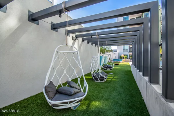 a view of a patio with swimming pool table and chairs