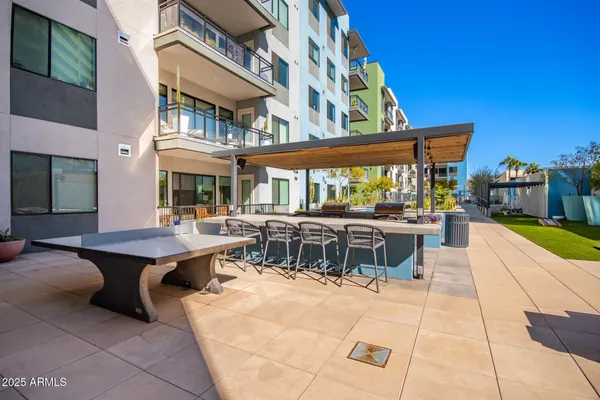 a backyard of a house with outdoor seating