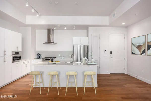an empty room with window and wooden floor