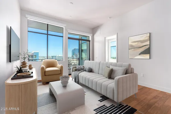 a view of a room with wooden floor and windows