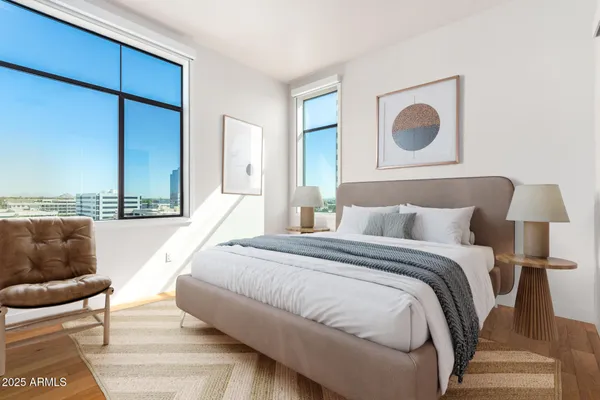a view of a room with wooden floor and a window