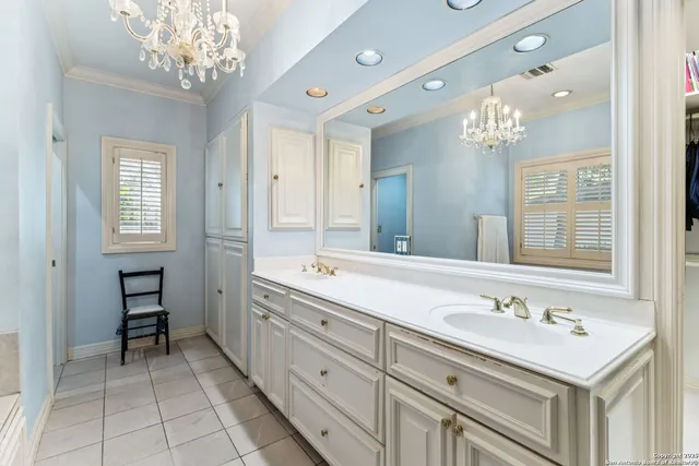 an aerial view of residential houses with outdoor space and trees all around