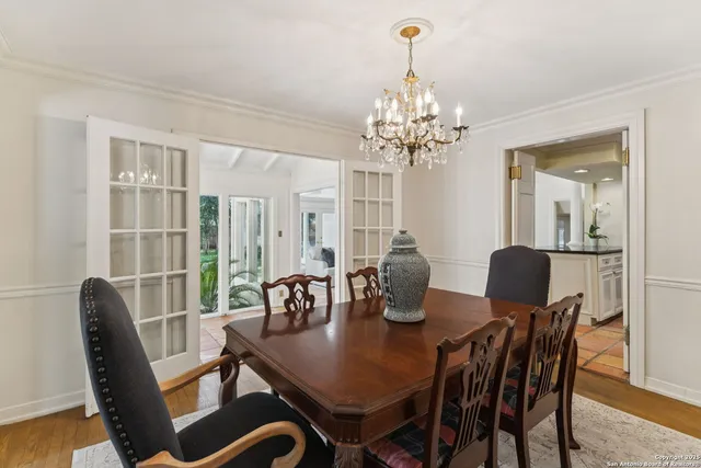 a kitchen with granite countertop a refrigerator and a sink