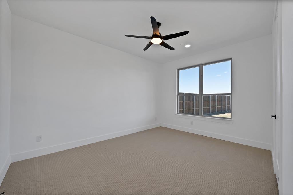 443 Whispering Way Red Oak, TX 75154 - Photo 27 of 36 a view of room with window and ceiling fan