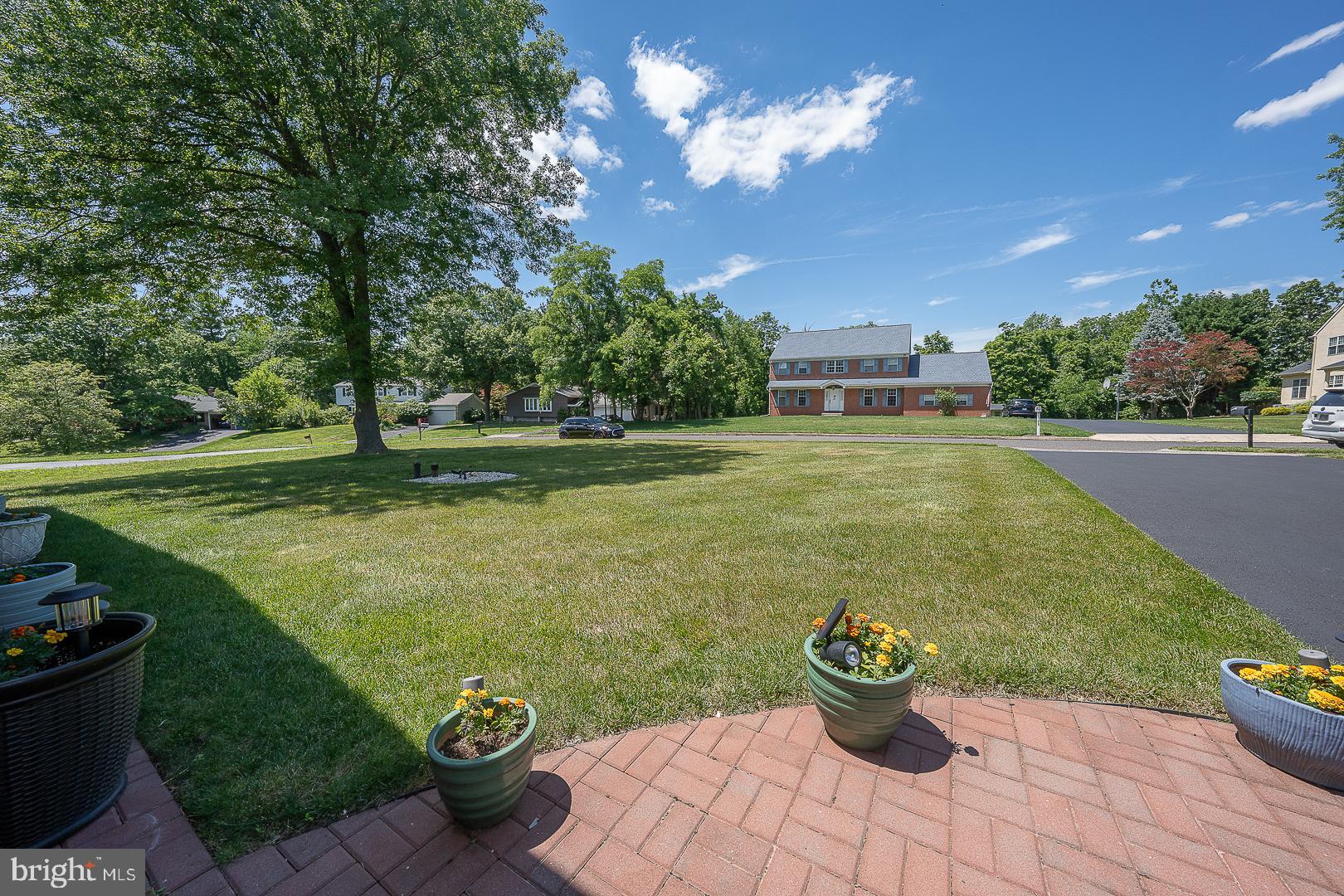 848 Mourning Dove Road Audubon, PA 19403 - Photo 56 of 86 a view of a garden with a dining table and a fire pit