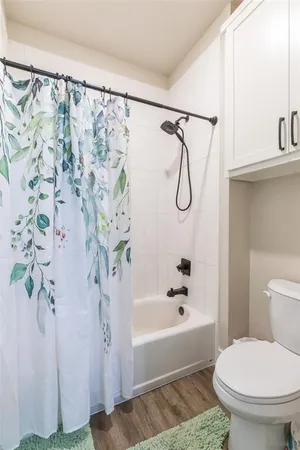 a spacious bathroom with a granite countertop sink and a mirror