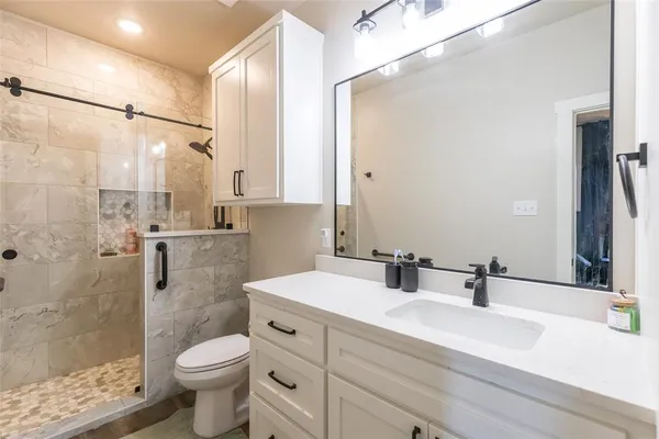 a utility room with cabinets washer and dryer