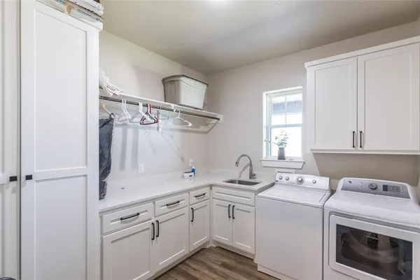 a living room with furniture and floor to ceiling windows