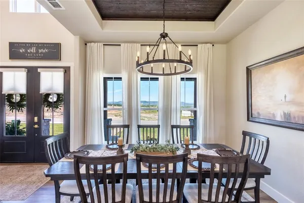 a large kitchen with a dining table and chairs