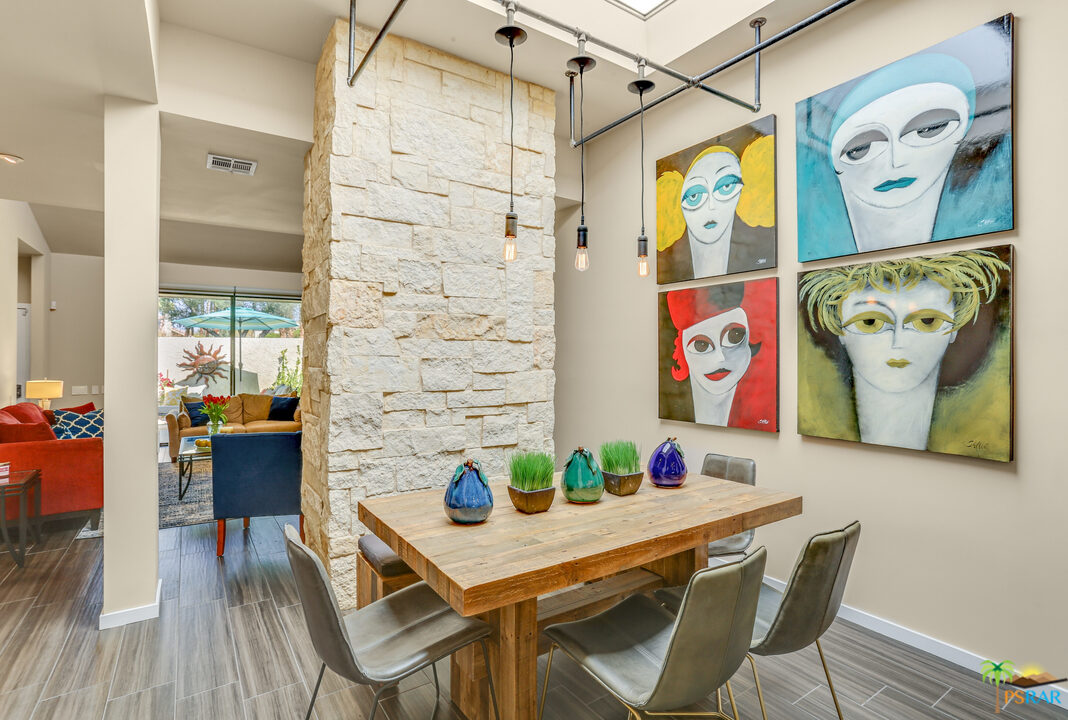 1314 East Andreas Road Palm Springs, CA 92262 - Photo 15 of 34 a view of a dining room with furniture and wooden floor