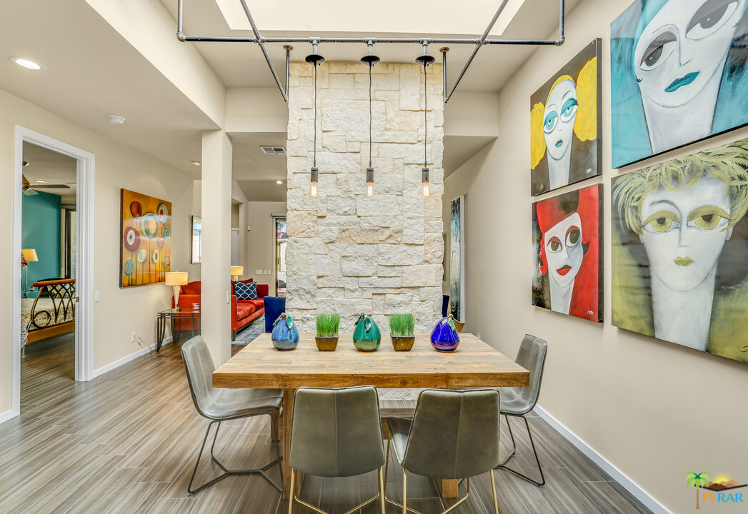 1314 East Andreas Road Palm Springs, CA 92262 - Photo 16 of 34 a view of a dining room with furniture and wooden floor