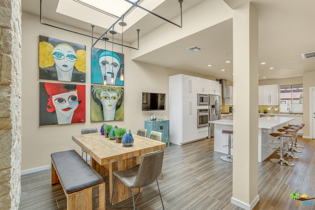 1314 East Andreas Road Palm Springs, CA 92262 - Photo 17 of 34 a view of a dining room with furniture and wooden floor