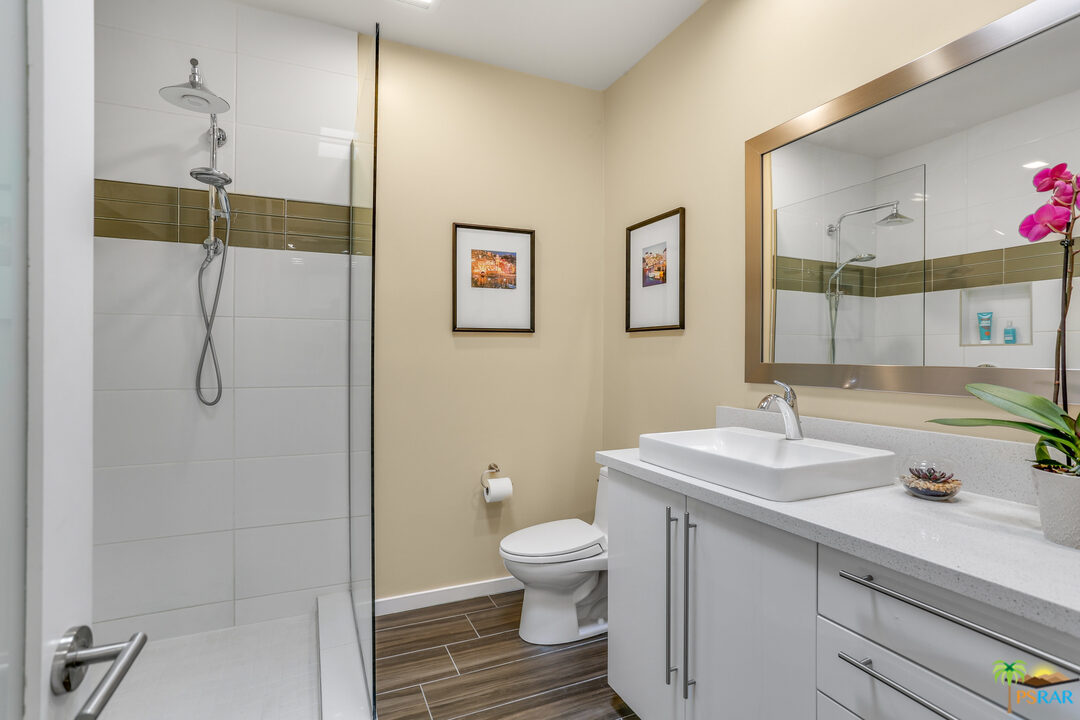 1314 East Andreas Road Palm Springs, CA 92262 - Photo 24 of 34 a bathroom with a sink a toilet and shower