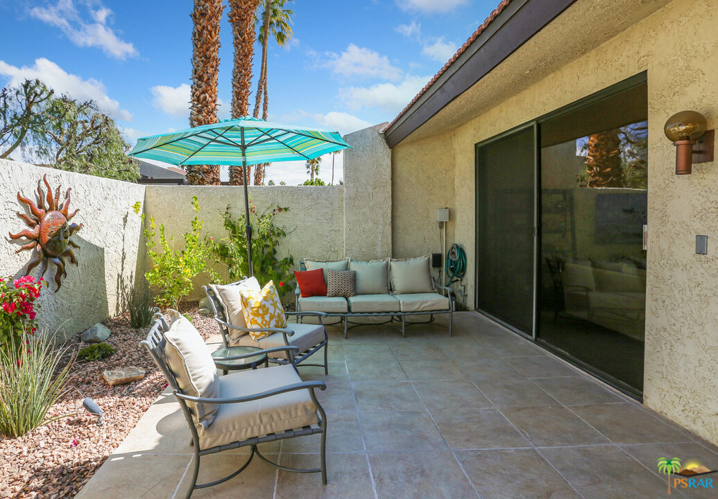 1314 East Andreas Road Palm Springs, CA 92262 - Photo 26 of 34 a backyard of a house with table and chairs
