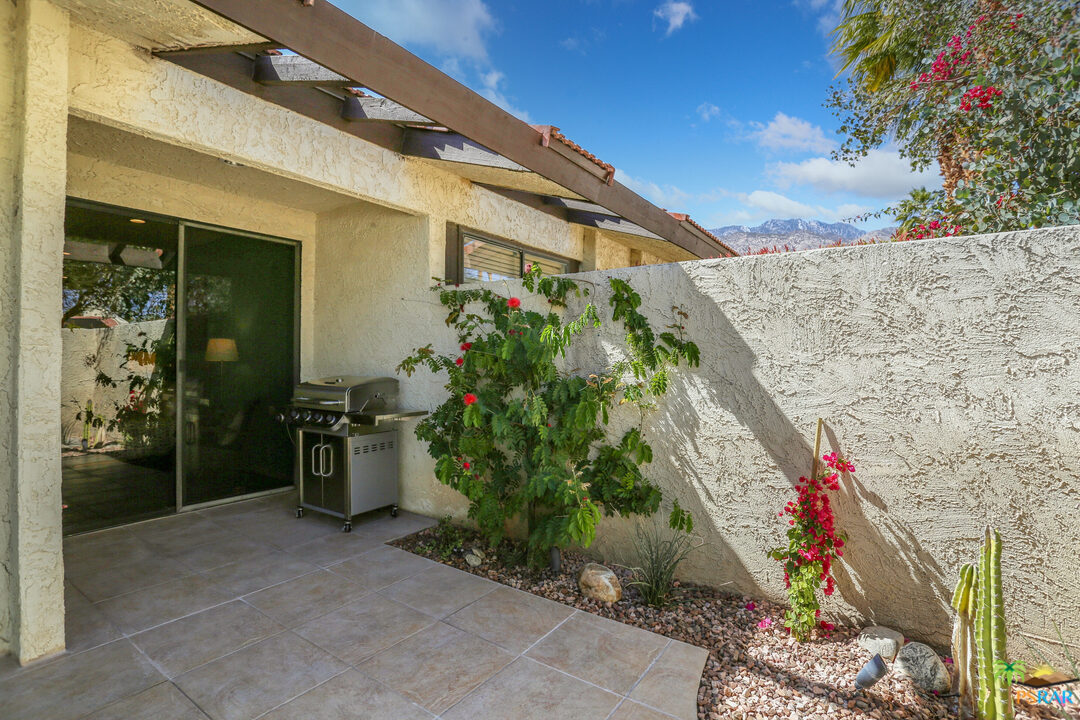 1314 East Andreas Road Palm Springs, CA 92262 - Photo 29 of 34 a backyard of a house with outdoor seating