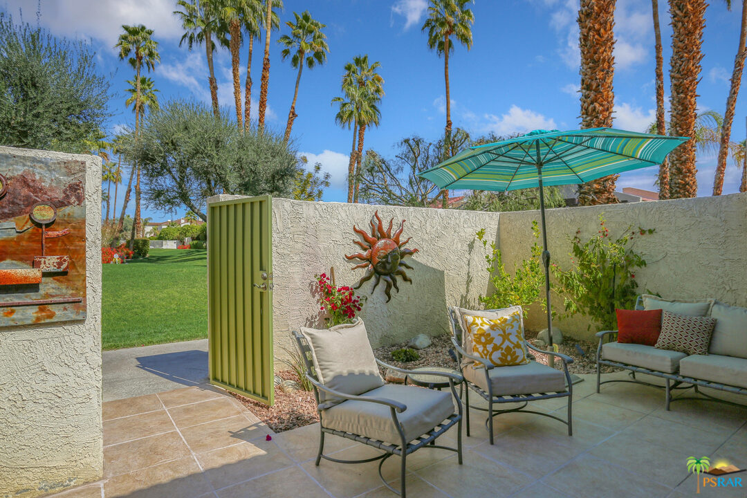 1314 East Andreas Road Palm Springs, CA 92262 - Photo 31 of 34 an outdoor space with furniture and umbrella