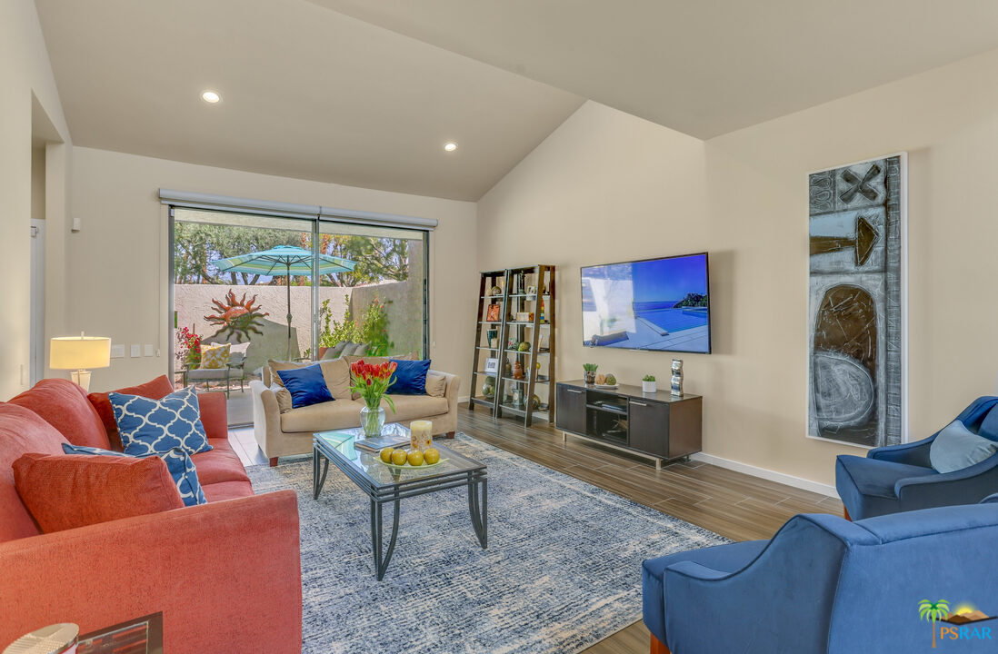 1314 East Andreas Road Palm Springs, CA 92262 - Photo 4 of 34 a living room with furniture and a flat screen tv
