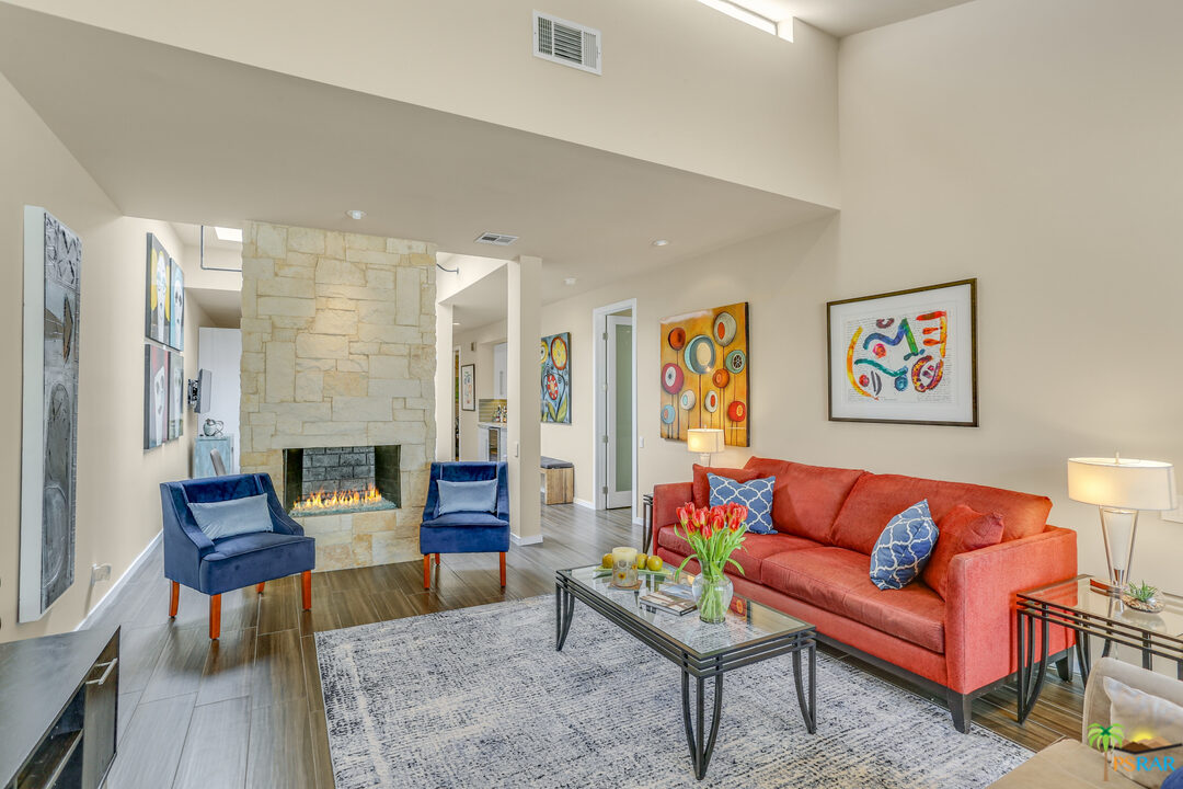 1314 East Andreas Road Palm Springs, CA 92262 - Photo 6 of 34 a living room with furniture and a fireplace