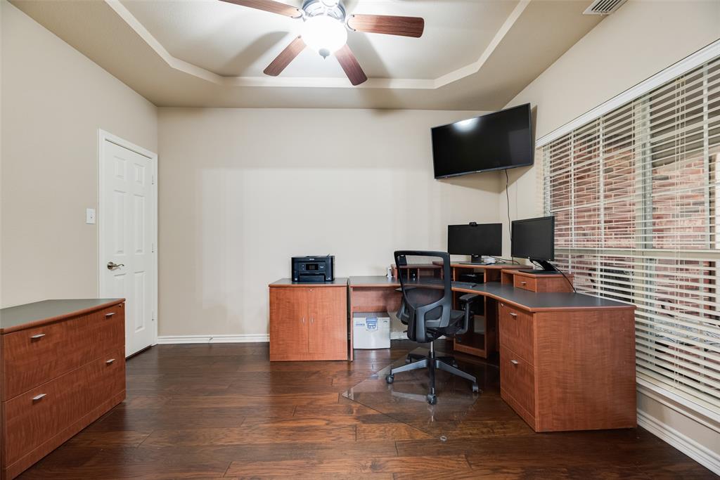 11920 Vienna Apple Road Fort Worth, TX 76244 - Photo 6 of 40 Front office with hardwood floors, ceiling fan and storage closet at 11920 Vienna Apple in Villages of Woodland Springs community in North Fort Worth