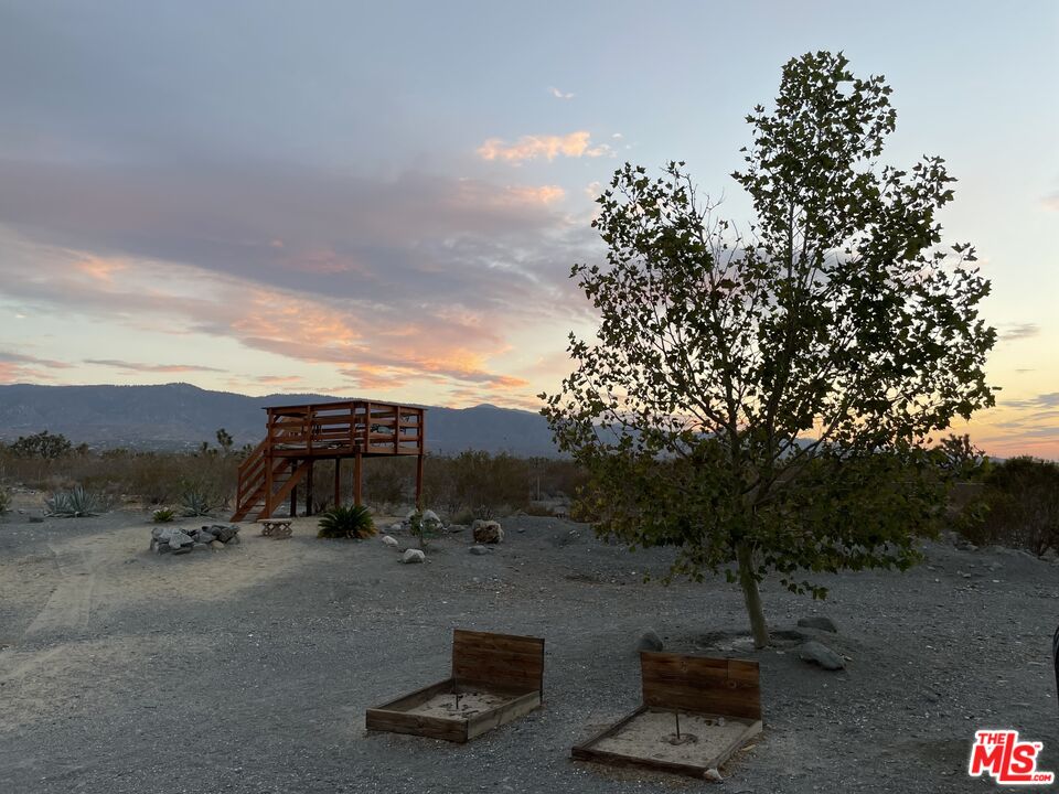 2625 Calaveras Road Pinon Hills, CA 92372 - Photo 20 of 24 a view of a city with tall trees