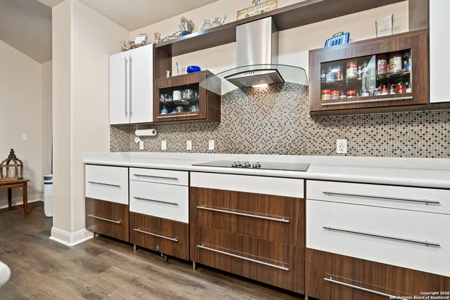 a kitchen with a sink and cabinets
