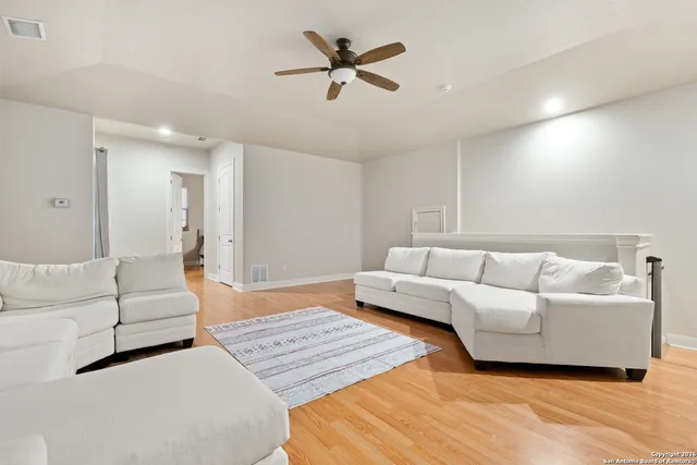 a bedroom with a bed and a chair