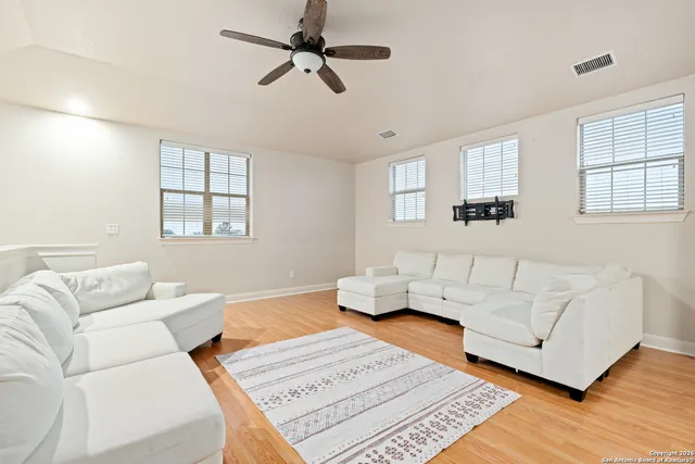 a view of a house with a yard and sitting area