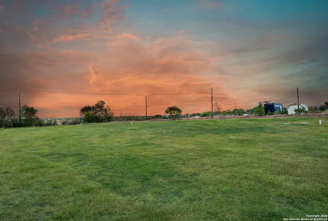 a view of a terrace with wooden floor and iron stairs